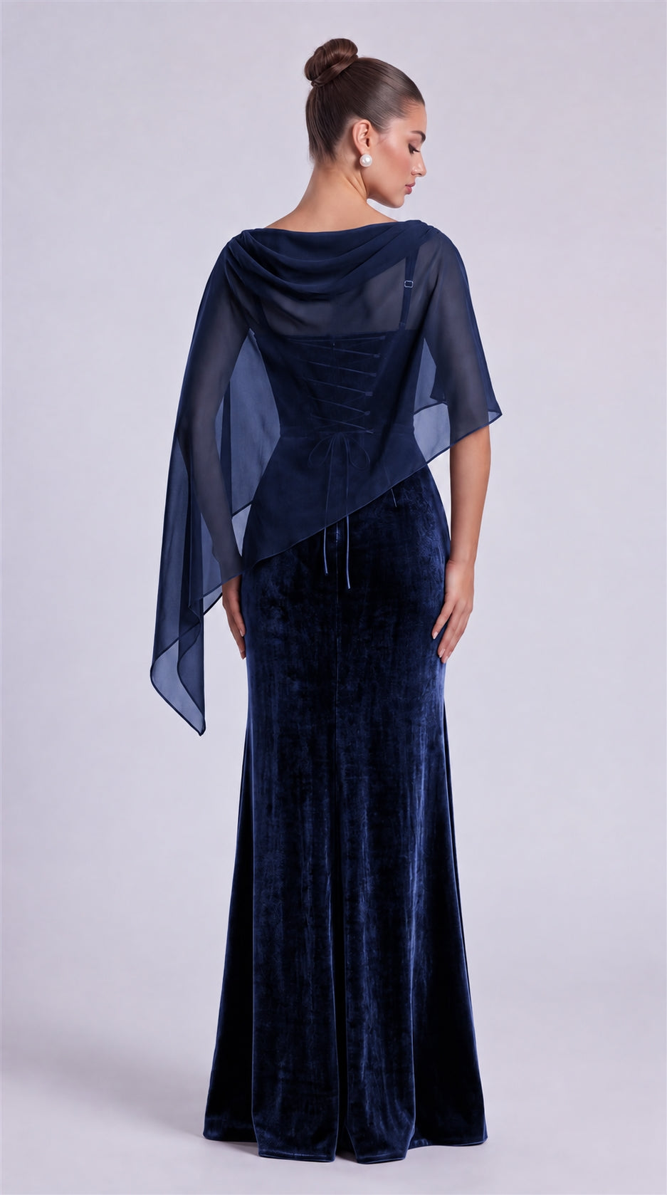 Navy Blue rear view of MEXMY velvet mermaid gown with sheer chiffon cape